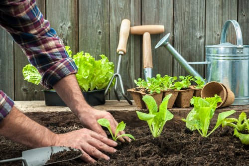 Local gardeners working on a well-kept Isle of Dogs garden